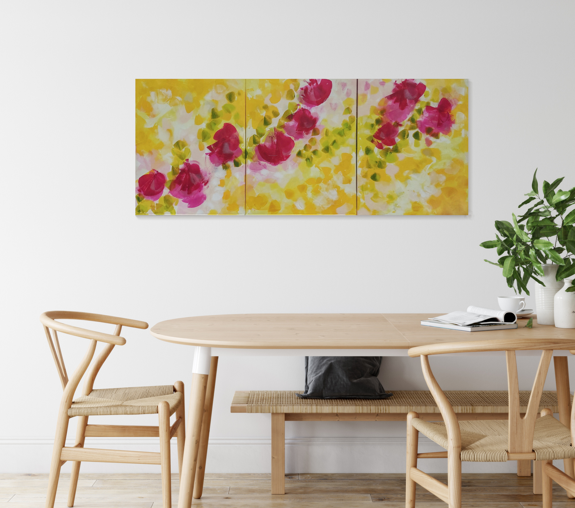 Big square painting in yellow green and gray hanging between two windows on a white wall behind a long white table in a conference room.